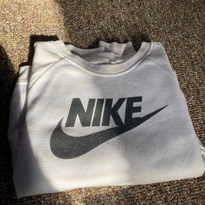 Nike long sleeve crewneck. Small blue stain, not even as big as a dime.